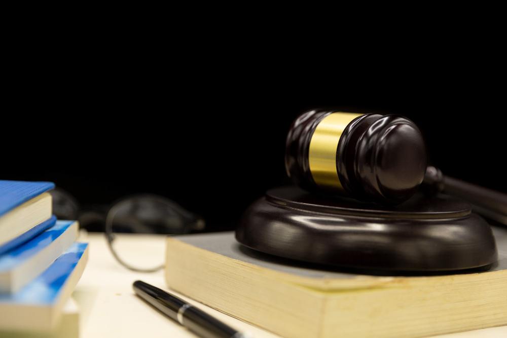 /upl/judges-gavel-on-book-and-wooden-table-law-and-justice-concept-background.jpg
