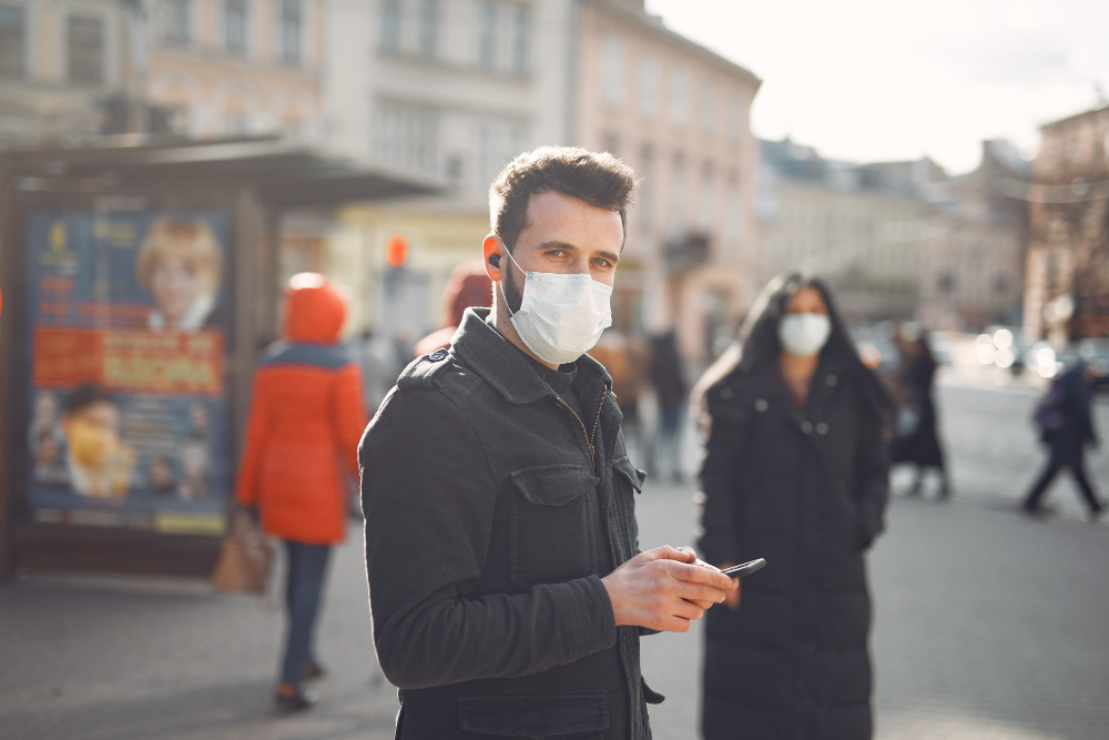 /upl/people-wearing-a-protective-mask-standing-on-the-street.jpg